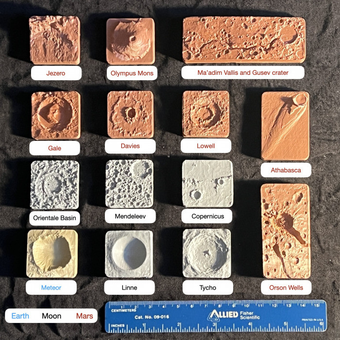 Set of 14 miniature planetary terrain models from Earth, the Moon, and Mars.